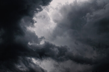 Dark storm clouds gathering in sky creating dramatic scene