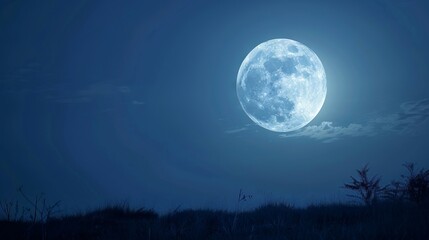 Naklejka premium Full moon in night sky with clouds. Beautiful full moon shining brightly in the night sky with clouds.