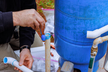 Water supply well system pump is being connected to house water supply