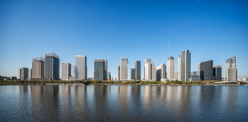 Naklejka premium Modern City Skyline by the Waterfront