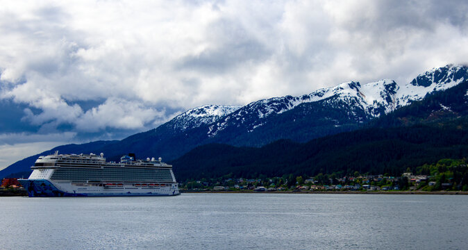 Large cruise ship in front of mountains in Juneau Alaska 