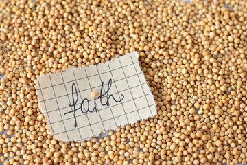Mustard seeds with handwritten word 