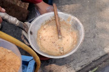 a typical food from betawi the province of DKI Jakarta, Indonesia made from eggs and sticky rice usually called kerak telor, being cooked in the traditional way