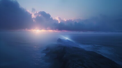 Dramatic sunrise over an ocean horizon with misty clouds, capturing the serene beauty of natural light and tranquil seascape.