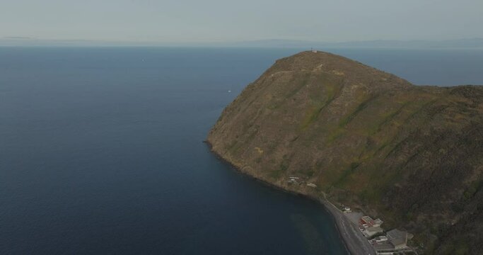 Aerial view of rocky coastline and majestic mountains by the sea, Lipari, Aeolian Islands, Italy.