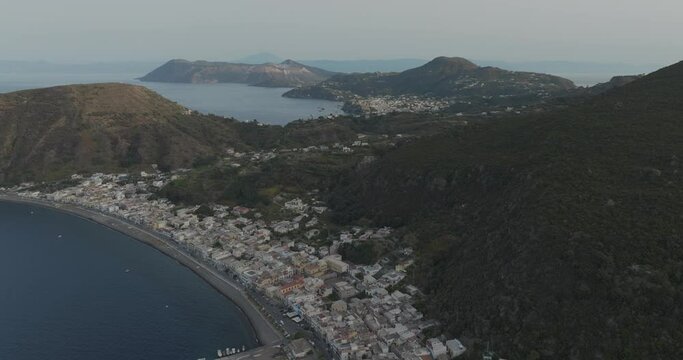 Aerial view of coastal town with mountains and sea, Lipari, Aeolian Islands, Italy.