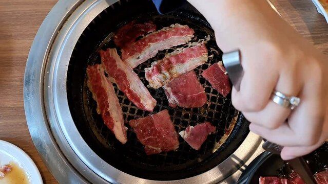 Meat Preparation On Grill Restaurant. Bbq table on a grill restaurant.	