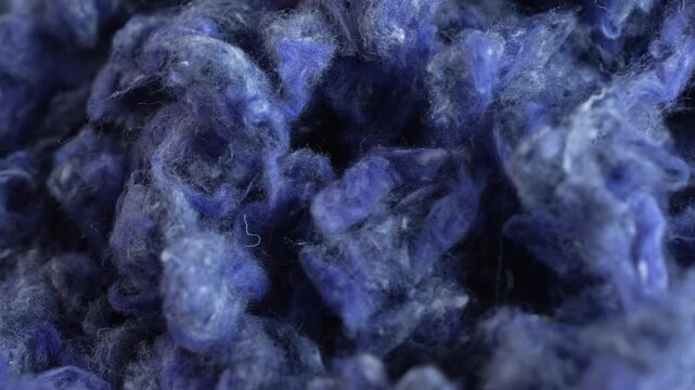 Reclaimed Denim Fiber. Denim jeans are repurposed by shredding the fabric and creating cotton fiber wadding