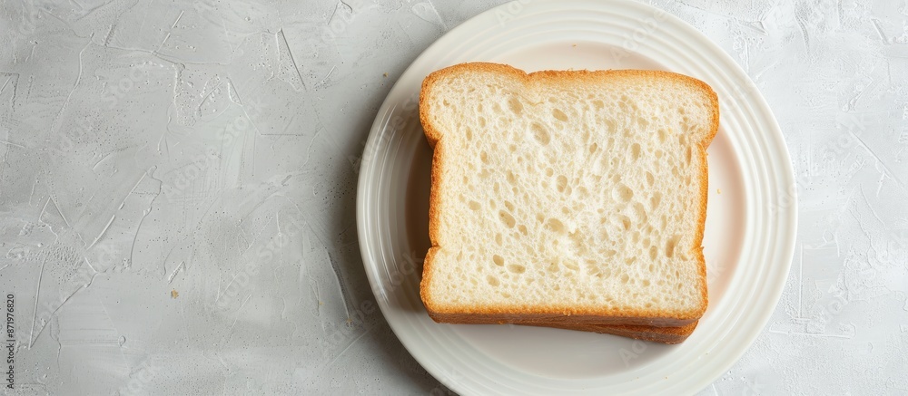 Poster a slice of bread displayed on a white plate, with copy space image.