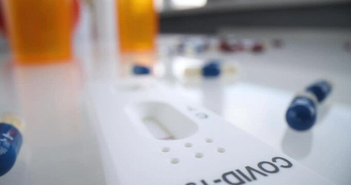 Rapid test for Covid-19 for home use and medicines in tablets. Covid-19 test kit for detecting IgM IgG antibodies and immunity in 15 minutes concept