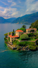 Aerial view of the luxury Villa Balbianello with terraced gardens, on the rocky wooded peninsula of Lavedo on Lake Como, panorama, picturesque residence. Green Planet. Nature. Lenno Italy 12.07.2024