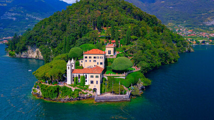 Aerial view of the luxury Villa Balbianello with terraced gardens, on the rocky wooded peninsula of Lavedo on Lake Como, panorama, picturesque residence. Green Planet. Nature. Lenno Italy 12.07.2024