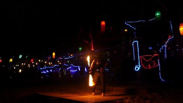 Man doing a fire show in koh phiphi in thailand