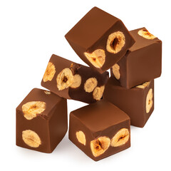  Cubes of milk chocolate bar with hazelnuts isolated on white background. Side view.