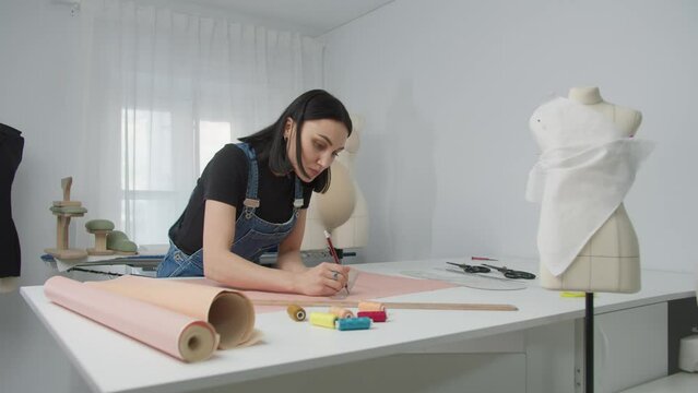 Woman Designs Pattern in Studio