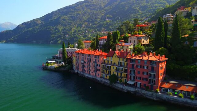 Aerial view of Lake Como. city ​​center. Bell tower. Tourism and romance. Mountains around the lake. Red roofs. Green Planet. Sailing yacht. Powerboat. travel to Italy, Bellano, 12.07.2024