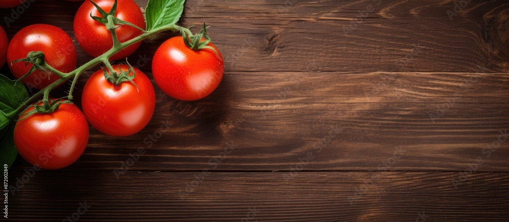 Aufkleber top view of fresh red tomatoes on a branch displayed on a dark brown wooden table with an oak textur