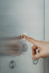 Finger Pressing Elevator Button © zhouyilu