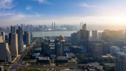 Obraz premium Modern City Skyline With River and Sunrise