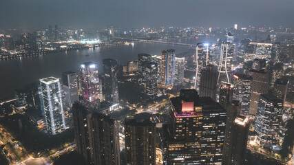 Fototapeta premium Night Cityscape of Illuminated Urban Skyline