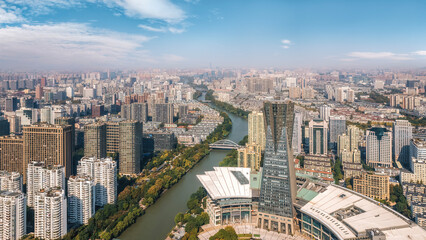 Naklejka premium Expansive Aerial View of Modern Cityscape Along River