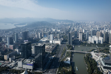 Obraz premium Modern Urban Skyline with River and Mountain View