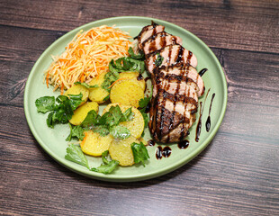 Pork with sauce, potatoes and salad - the perfect lunch