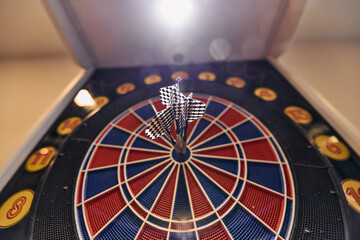 Dart board has dart arrow hitting of a shooting target for business targeting and good success