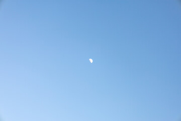 Crescent Moon in a Serene Blue Sky