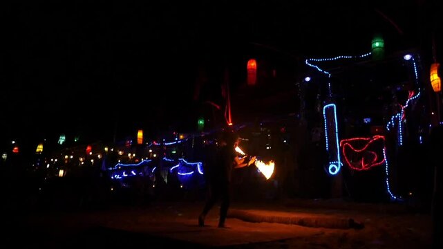 Man doing a fire show in koh phiphi in thailand