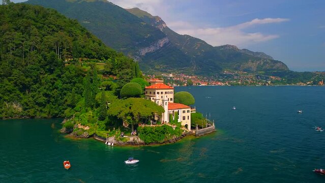 Aerial view of the luxury Villa Balbianello with terraced gardens, on the rocky wooded peninsula of Lavedo on Lake Como, panorama, picturesque residence. Green Planet. Nature. Lenno Italy 12.07.2024
