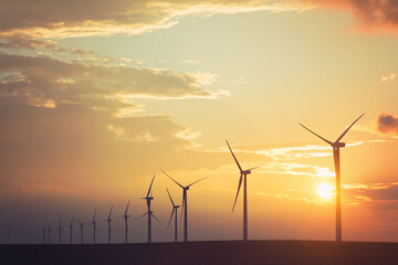 wind turbines in the sunset