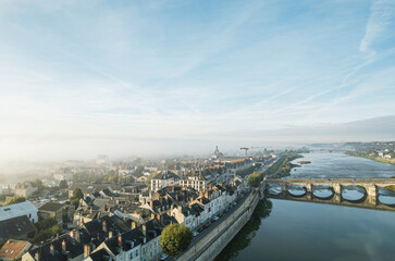 A misty morning view of tours and the loire river