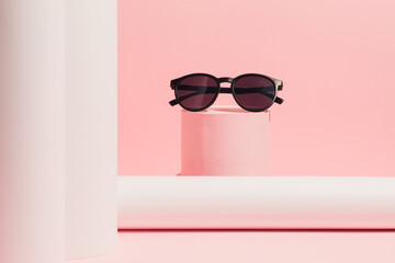 Black sunglasses on product podium. Suitable for Product Display and Business Concept on pastel...
