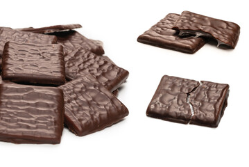 Dark chocolate candies isolated on white background.