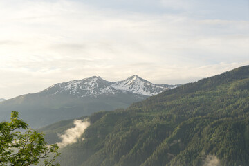 Landscape of valley with fog in the austrian village Bramberg near the mountain Wildkogel