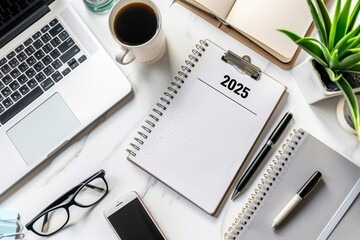 Young hands writing in notebook 2025 new year's resolutions index list over wooden table