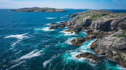 Aerial view of rugged northern coastline, waves hitting rocky shore, bright clear day, blue waters