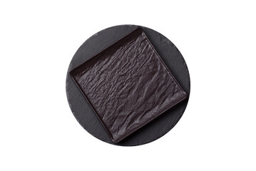 Empty round slate plate for template on the black background