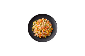 Delicious boiled rice with vegetables corn, carrots, peas with salt