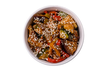 Spicy Asian dish with sliced meat fillet, hot pepper, carrots and sesame seeds