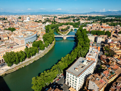 Aerial photo with drone over the Tiber River on the border with Trastevere in Rome Italy