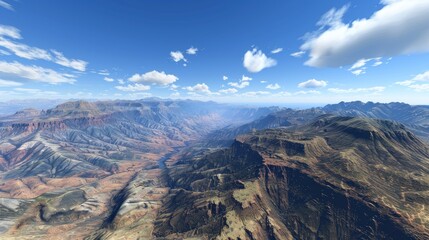 Aerial View of a Mountain Range with Blue Sky and Clouds
