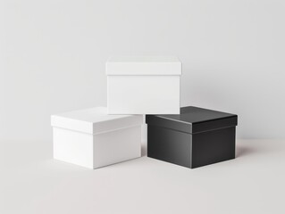 Minimalist photo of black and white storage boxes on a neutral background, perfect for organization and packaging themes.