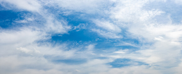 White clouds of different shapes in the blue sky