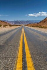 Fototapeta premium A long and winding road stretches out into the distance, with mountains in the background. AI.