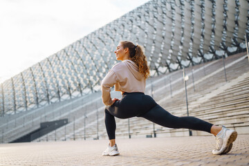 Fit woman exercising outdoors. Healthy young sportswoman doing fitness. People, sport, active and...