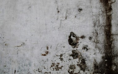 cracked concrete wall covered with gray cement surface as background, rack concrete white wall or Cement wall background, Broken hole in white wall. Abstract background.
