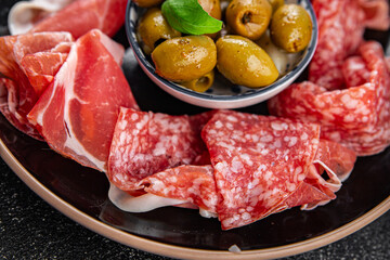 appetizer plate salami, prosciutto, sausage, coppa meat plate food fresh appetizer meal food snack on the table copy space food background rustic top view