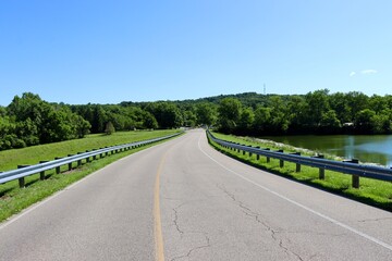 The long empty road in the countryside on a sunny day.